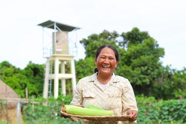 Woman infront of solar water pump
